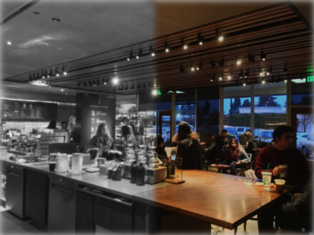 A photo of a coffee shop, with the left side in black and white and the right side in color.