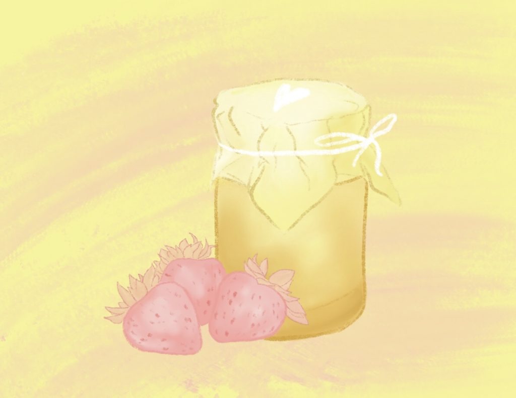 A jar of honey with some strawberries beside.